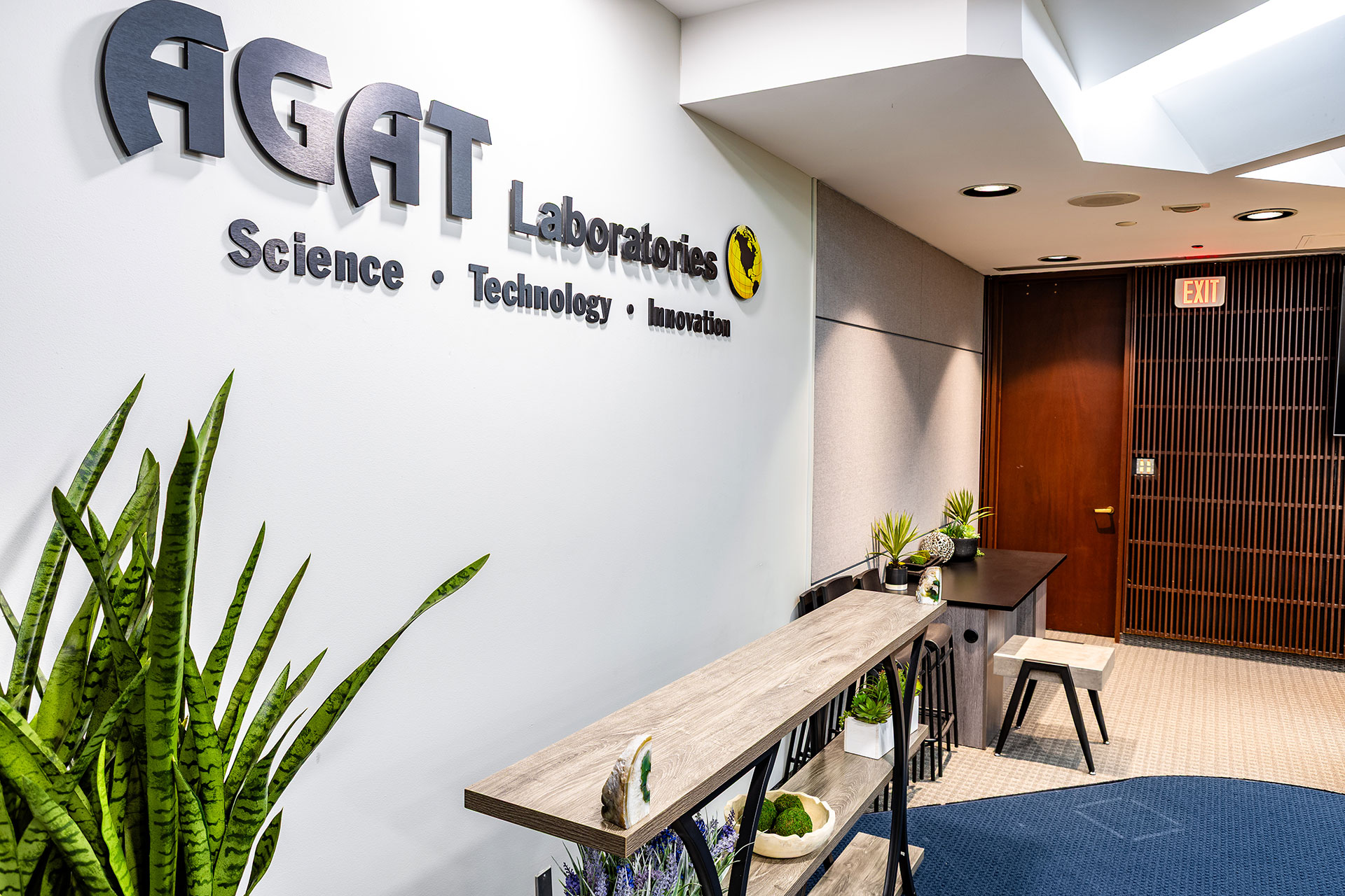 Angled view of the AGAT Laboratories auditorium wall and seating inside the Michael DeSanti Centre for Excellence.