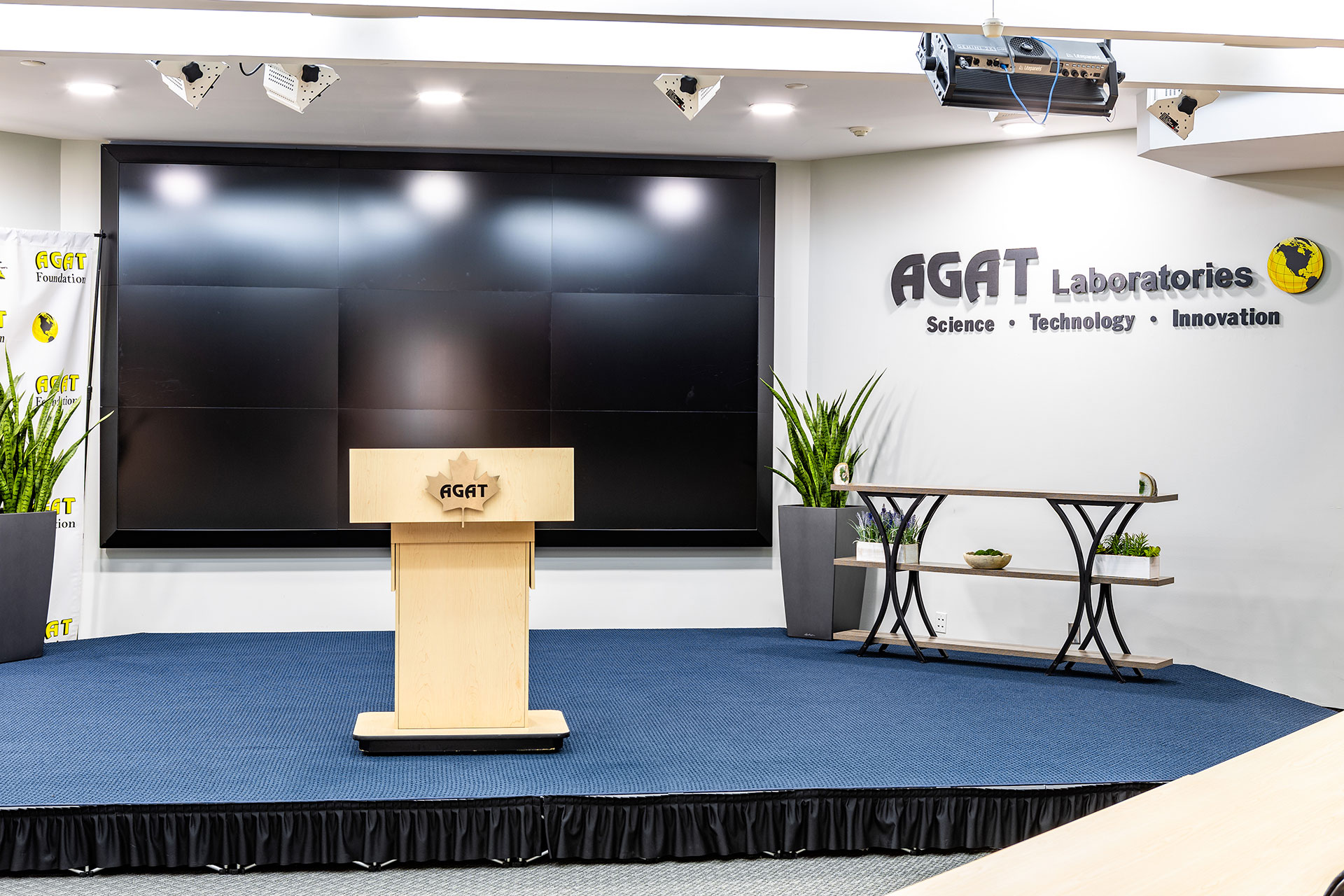 Stage and video wall setup in the Michael DeSanti Centre for Excellence auditorium.