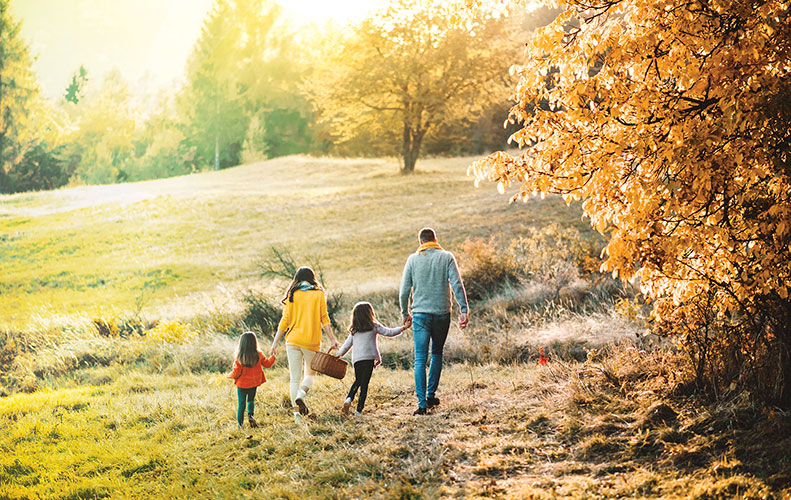 Family walking together outdoors in autumn